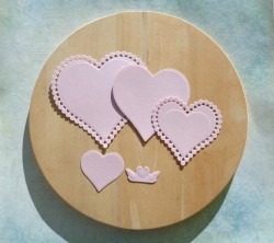 Cutting down a set of hearts pink designer paper mother of pearl 290 gr.